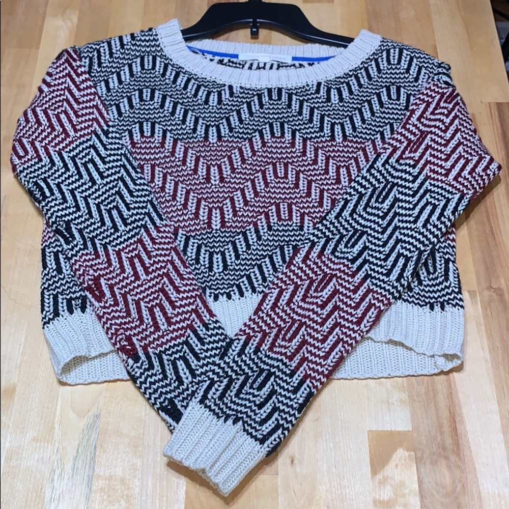 Black beige and red sweatshirt